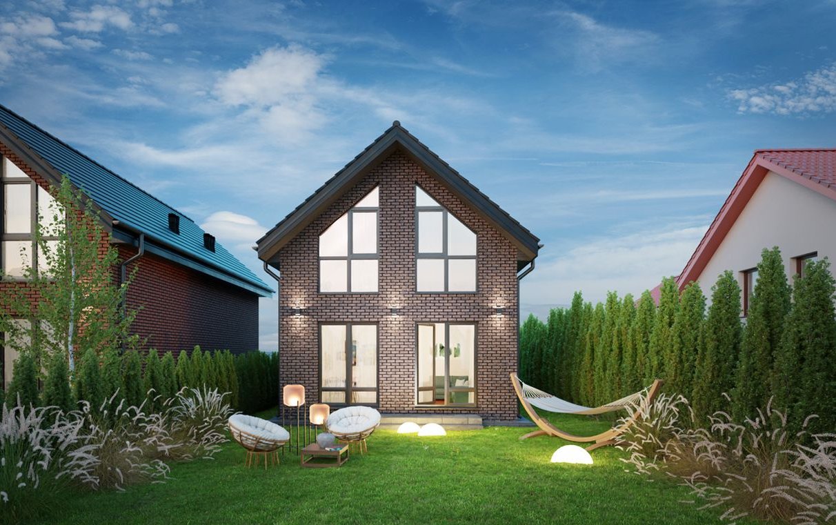 Stylowy dom z cegły klinkierowej w zabudowie wolnostojącej