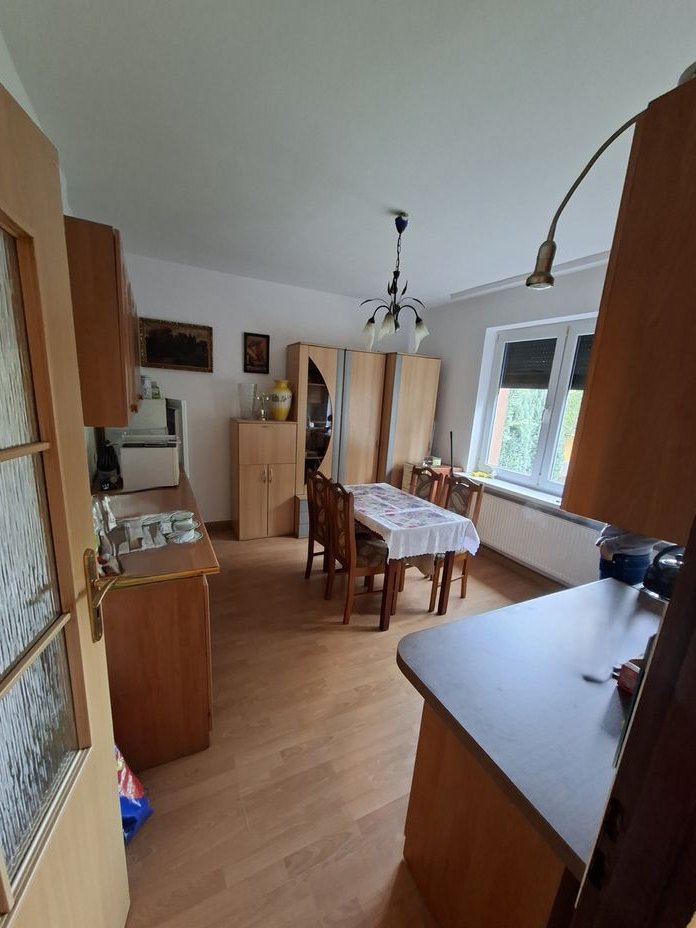 Na sprzedaż -Połowa domu na parterze z garażem i ogrodem Amelung