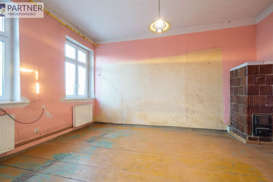 Dom z zabudowaniami na dz. 4 400 m2 (udział 1/2)