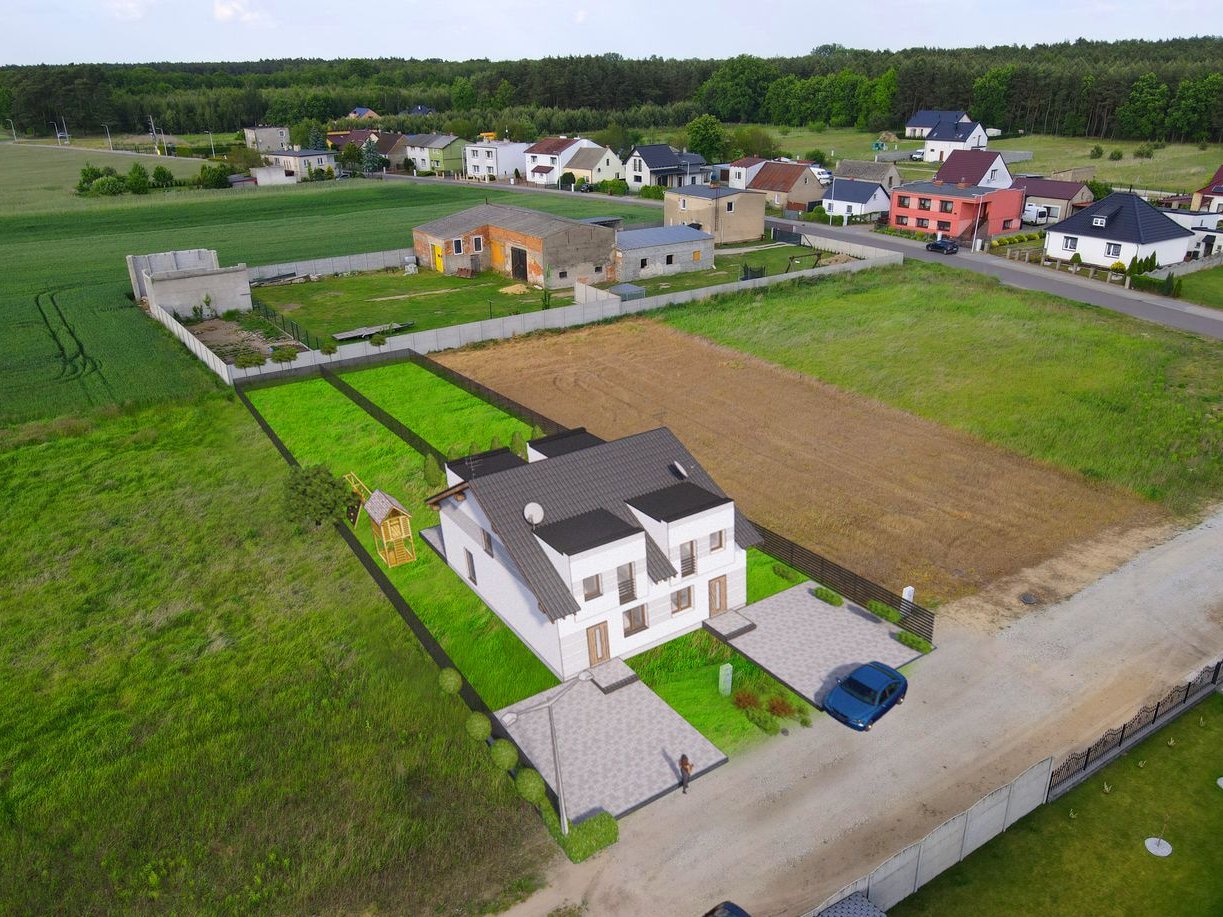 Nowy dom pod miastem w zielonej okolicy.