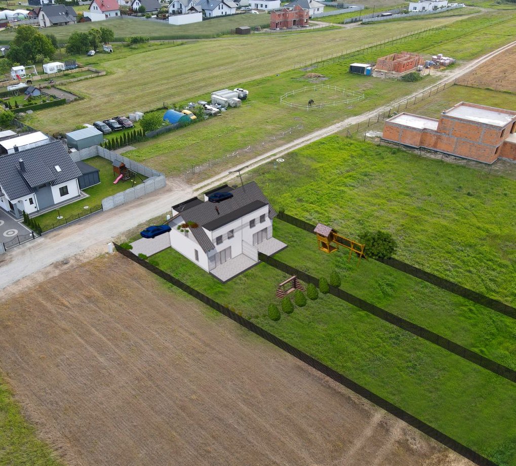 Nowy dom pod miastem w zielonej okolicy.