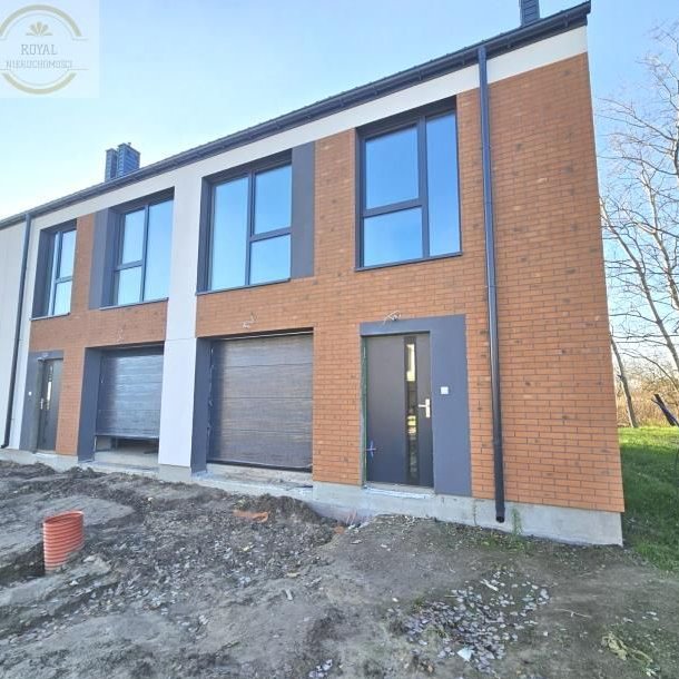 Skrajny segment z garażem i ogrodem