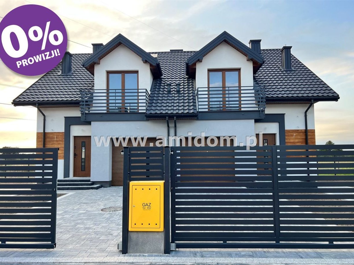 Nadbiel,dom w zabudowie bliżniaczej z garażem