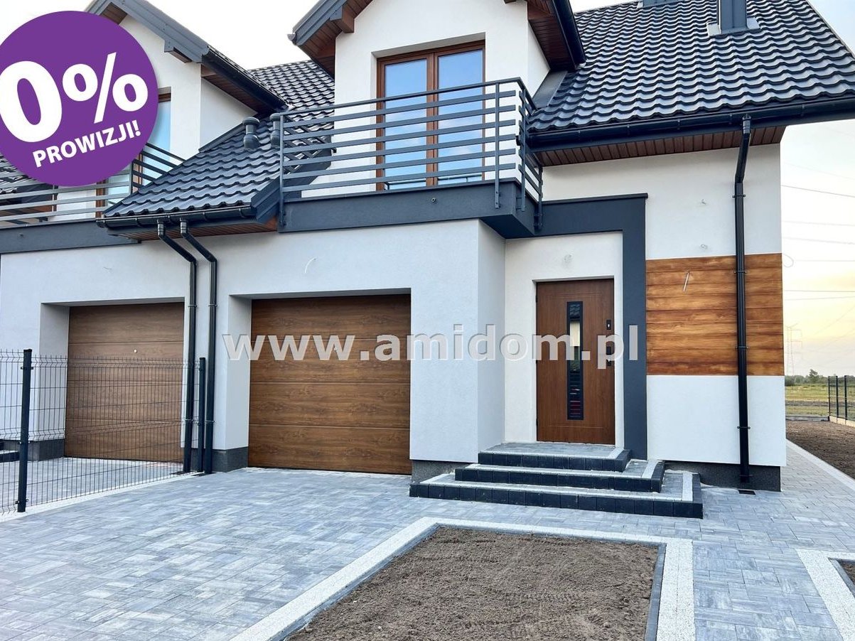 Nadbiel,dom w zabudowie bliżniaczej z garażem