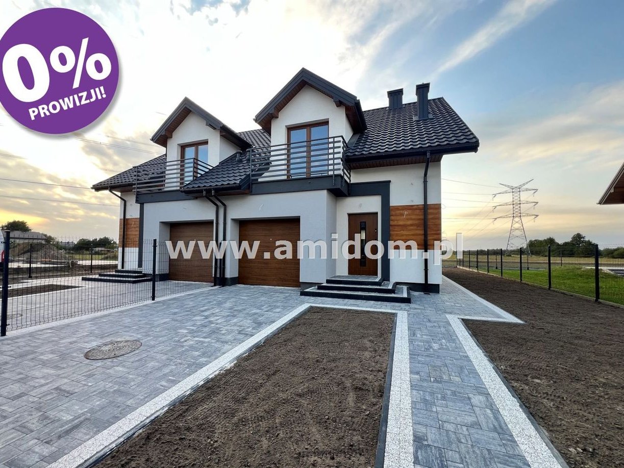 Nadbiel,dom w zabudowie bliżniaczej z garażem