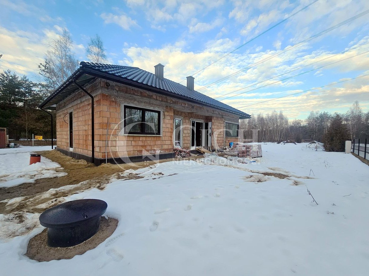 Parterowy dom 109,59 m² z tarasem i widokiem na las